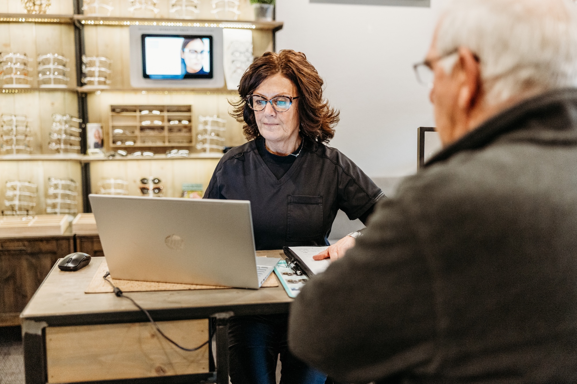 Photo of a patient picking out new frames